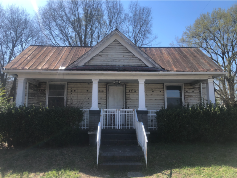1802 Taylor Street, after asbestos shingles were removed. The house is being fully renovated. 