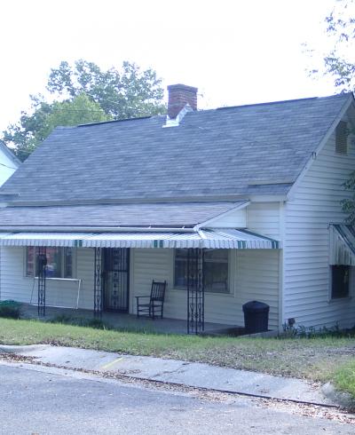 Street view image of a one-story white house on 514 Gray Avenue