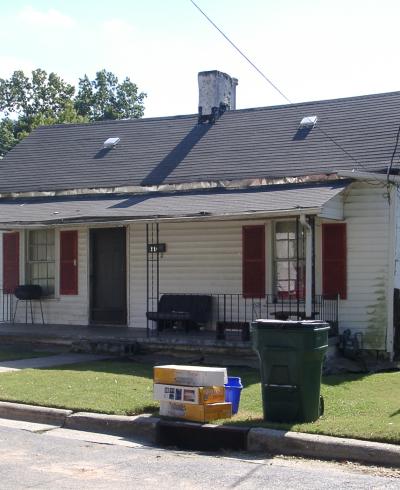 Street view image of a one-story white house with red shutters at 516 Gray Avenue.